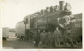 Four Men in Front of Grand Trunk Pacific Steam Engine #400 in Biggar, Saskatchewan