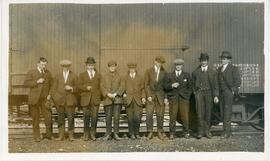 Group Of Men In Front Of train Car
