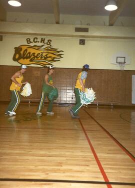 High School Students With Cheer Leading Pom Poms Gymnasium