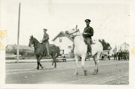 Soldiers Riding Horses on Main Street in Biggar