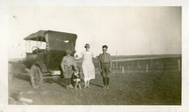 Walter, Gordon, and Mrs. John Holst in Biggar, Saskatchewan