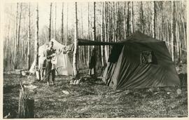 Two Men Beside Two Tents