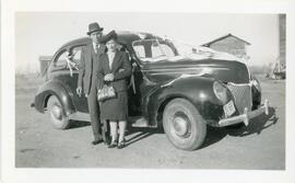 A Married Couple With Their Wedding Car in Biggar, Saskatchewan