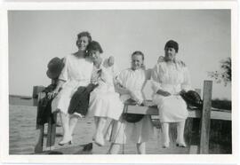 Four Women On A Dock