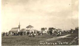 Victoria Park with people gathered in front of the band shell