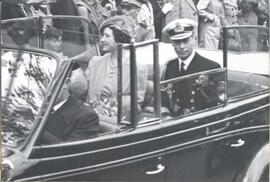 King George VI and Queen Elizabeth riding in a convertible