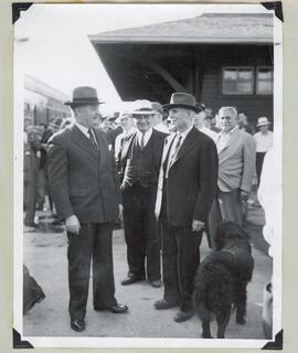Thomas H. Garry and Chas. A. Dunning meet on the C. P. R. station platform