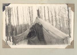 First Nation women peeking out of tent