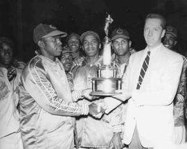 Indian Head Rockets receiving trophy