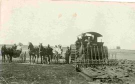 Brown family farm with a large 12-furrow plow