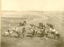 Large group of men and women on horseback