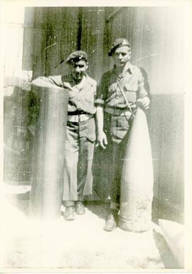 Two soldiers of 17th Field Regiment posing with bombs