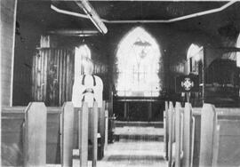 Reverend standing in a church