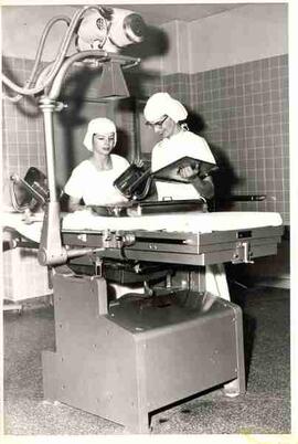 Two women at urology operating table and x-ray, Providence Hospital