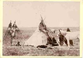Indian family in front of tipi
