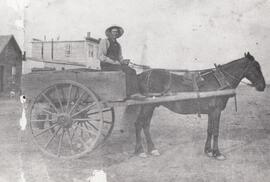 James R. Wilson with water wagon, Moose Jaw, Northwest Territories, 1885