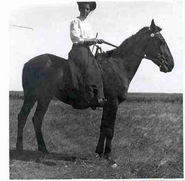 Unidentified woman on horseback