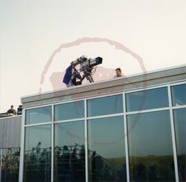 Camera man filming Living in Harmony from top of roof