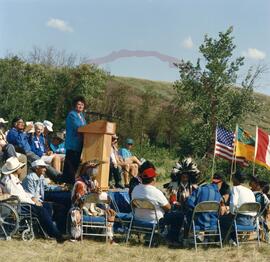 Gail McDonald at podium of official opening ceremony