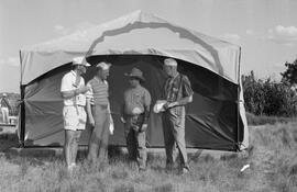 Dr. Ernest G. Walker, William Thomas Molloy and two others in front of excavation tent