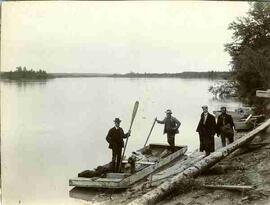 Men with boats at lake