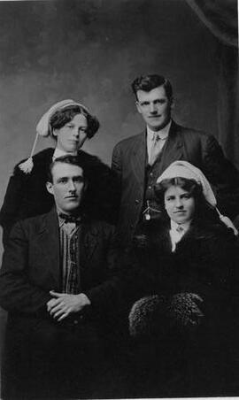 Two couples in period dress