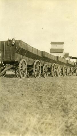 Grain wagons hooked in tandem