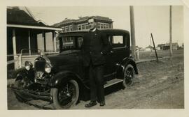 Rev. Benjamin Crowe beside 1930 Ford Model A car