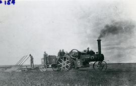 Steam Powered Engine pulling an eight furrow plow