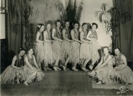 Woman performers in grass skirts