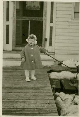 Little girl (toddler) on wooden walkway