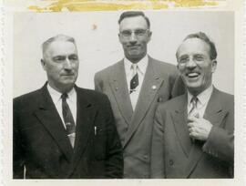 Three men at Board of Trade meeting