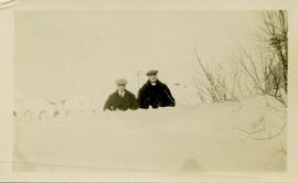 Rev. Benjamin Crowe and another man behind snowdrift