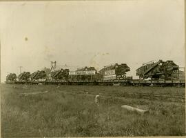 CPR train loaded with threshing machines.