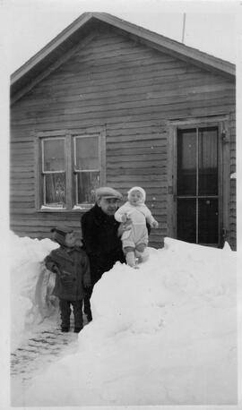 Jack Davison and children on snowbank