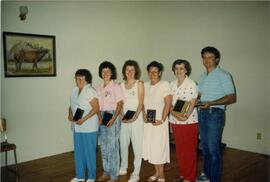 Hospital staff holding plaques