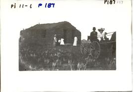 Pioneer sod shack and buggy