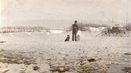 Man and Two Dogs in the Snow