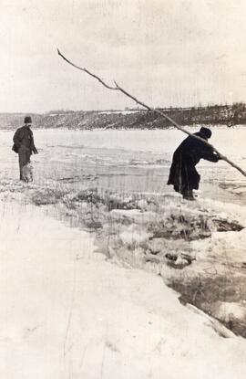 Two Men on a River Bank in the Winter