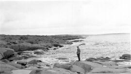Man Standing on a Shore Line