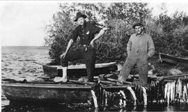 Two Men Standing in a Boat