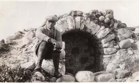 Man in Front of a Stone Structure