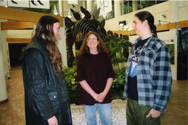 Donna Postnikoff and sons Andrew, left, and Derek, chat near the dinosaurs in the atrium of the U...