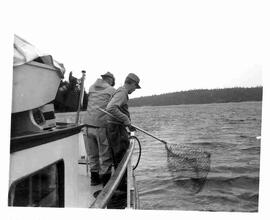 John Diefenbaker fishing aboard a boat off the coast of British Columbia
