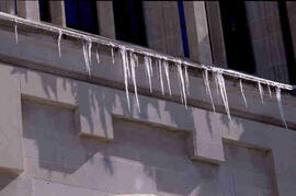 Icicles and grey stone