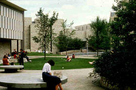 Students sitting outside of arts building