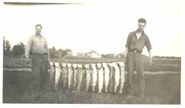 John Diefenbaker and Bill Donaldson displaying their catch of fish