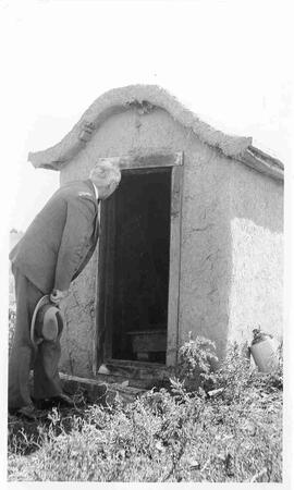 W.C. Murray looking in a shed