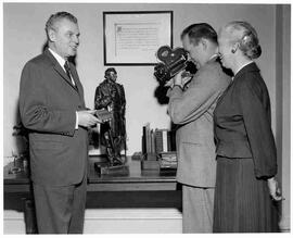 John Diefenbaker holding a plaque in Prime Minister's Office