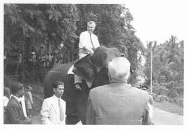 John Diefenbaker riding an elephant